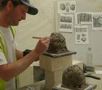 Modelling fullscale maquettes in clay  of label stops for client and architects approval in the workshop