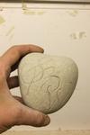 A marble pebble from Cyprus with an initials carved for a wedding gift in Sydney.Australia.